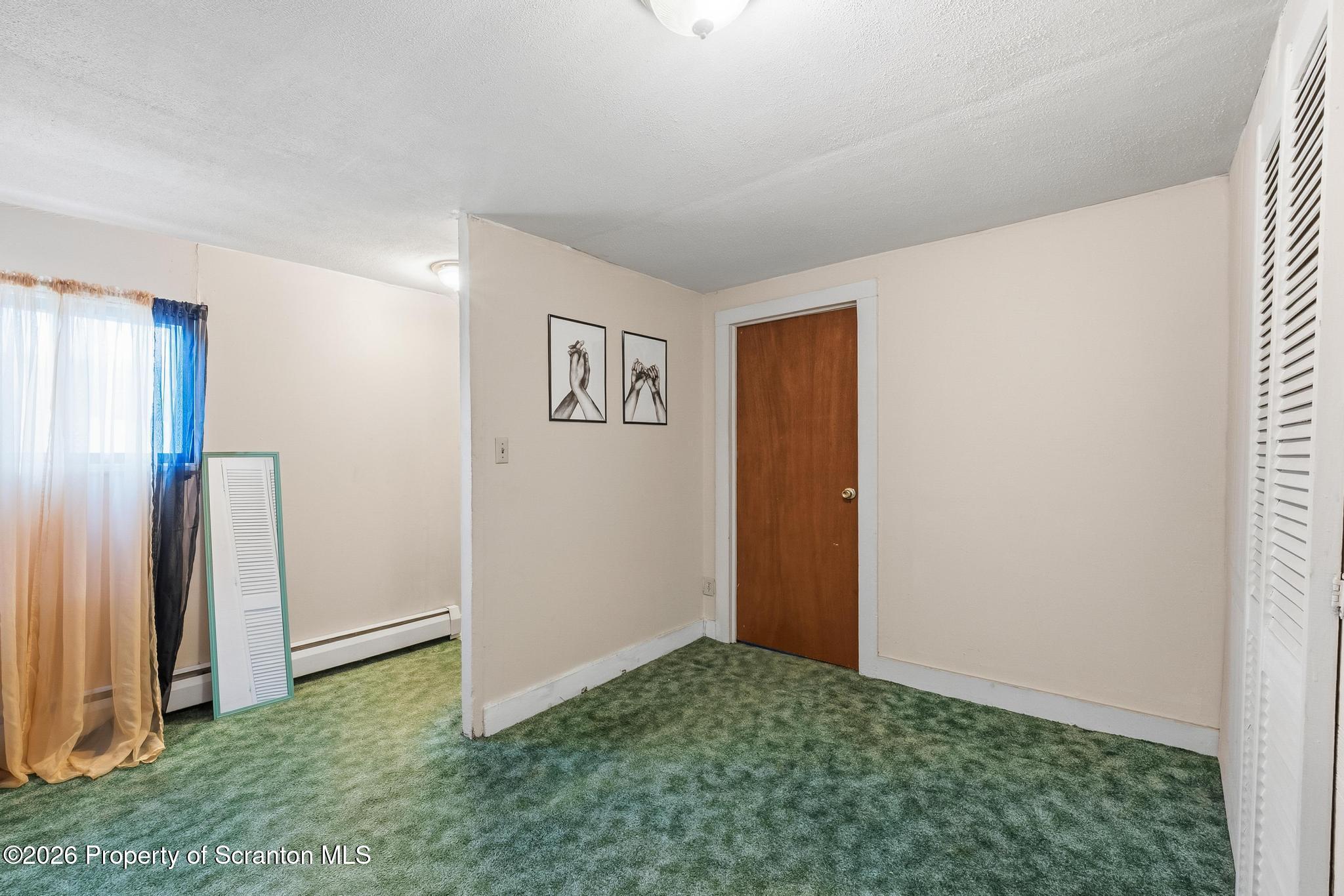 810 Pine Street Mayfield, PA 18433 - Photo 27 of 37 an empty room with a door
