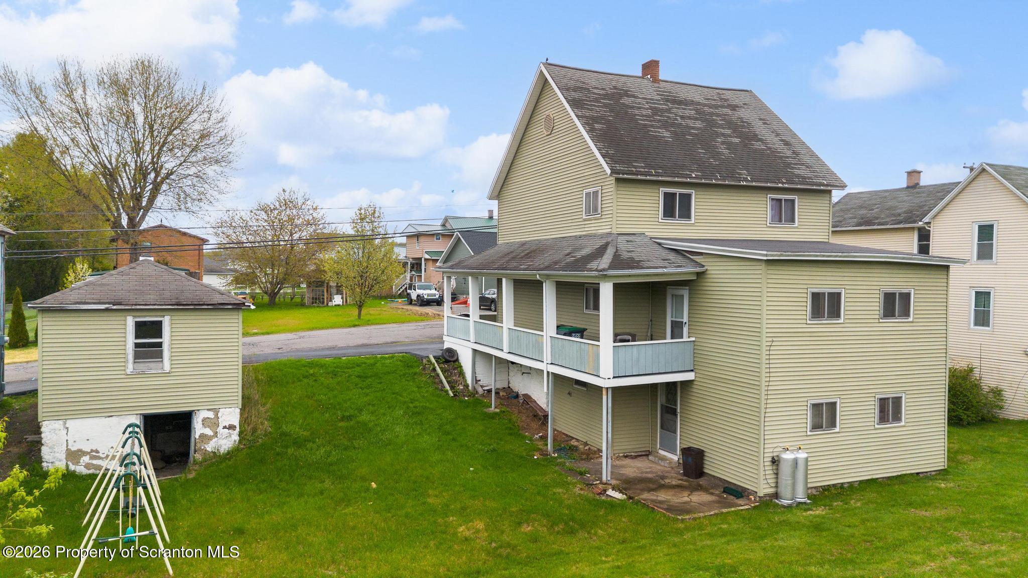 810 Pine Street Mayfield, PA 18433 - Photo 5 of 37 a aerial view of a house with a yard patio and swimming pool