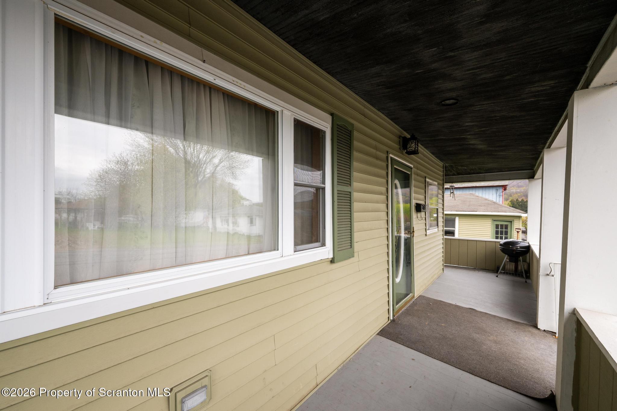 810 Pine Street Mayfield, PA 18433 - Photo 7 of 37 a view of a porch of a house