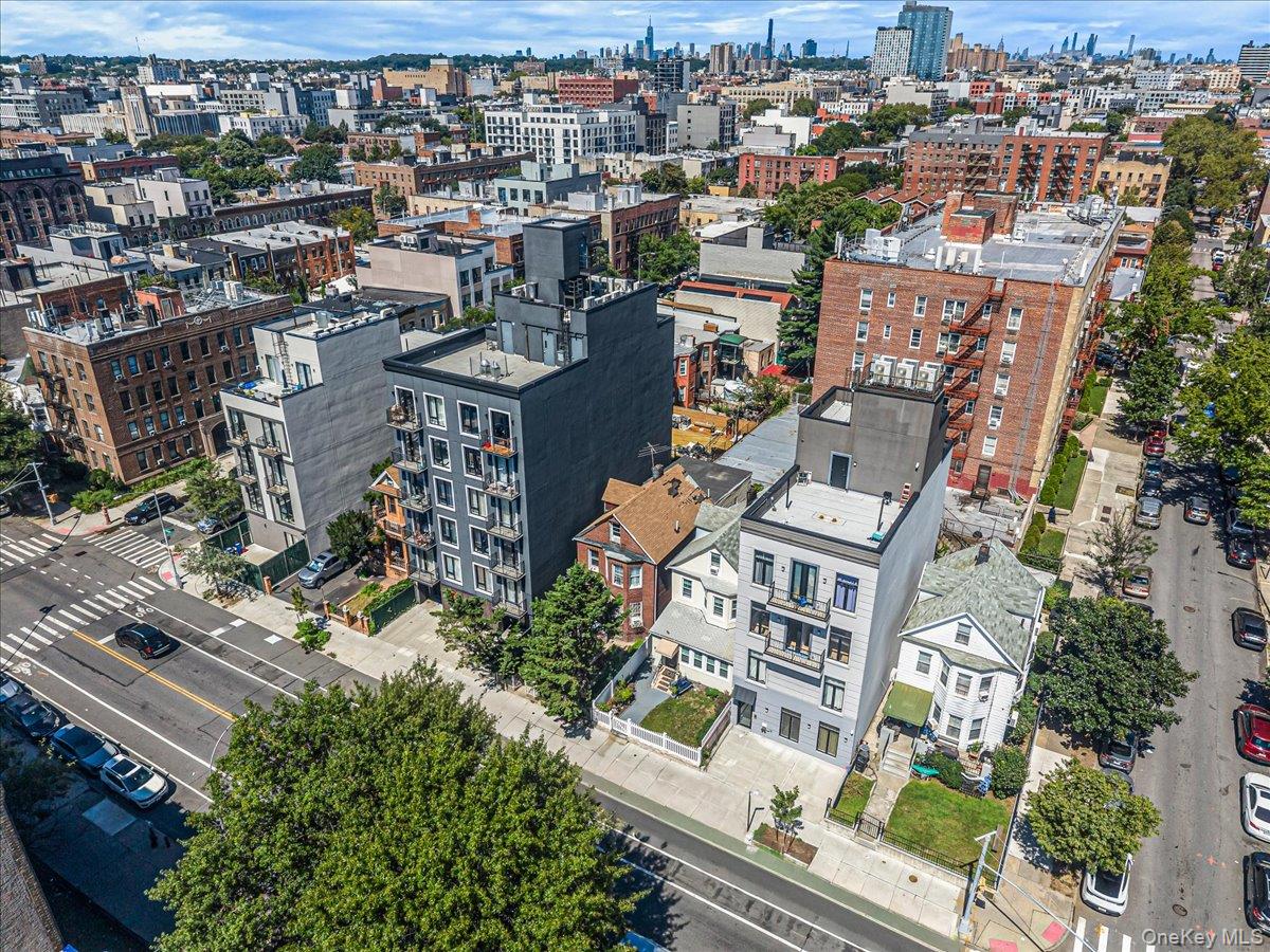 2811 Clarendon Road Brooklyn, NY 11226 - Photo 7 of 11 Modern facade with multiple balconies, rooftop access, and a street-level gated entrance