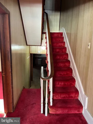 a view of a hallway with a chandelier
