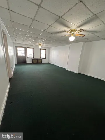 a view of empty room with windows