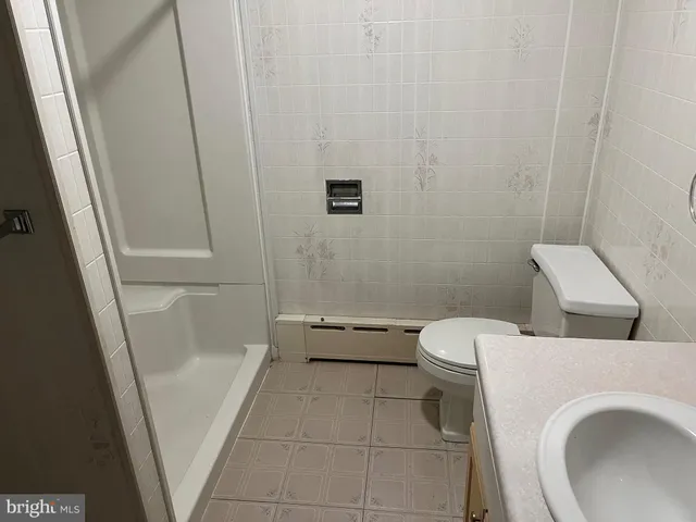 a view of an empty room with a chandelier