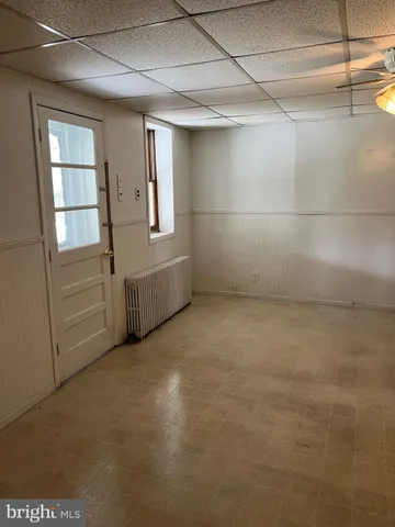 a view of empty room with windows