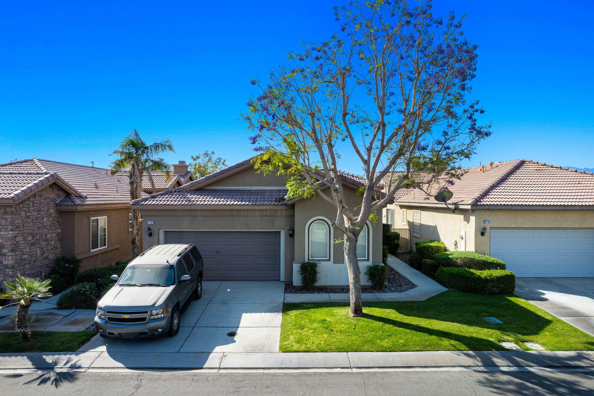 a front view of a house with garden