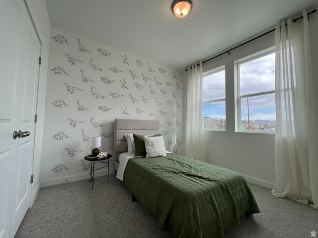 718 West Blue Magic Lane, Unit S201 Midvale, UT 84047 - Photo 5 of 18 Bedroom featuring carpet and wallpapered walls