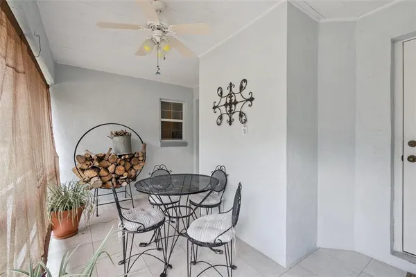 a dining room with furniture and window