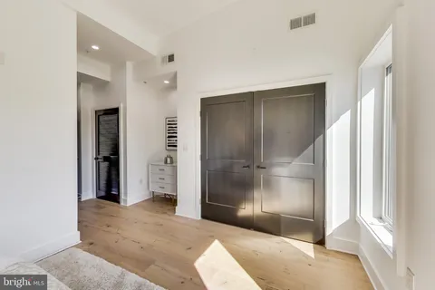 a view of entryway with wooden floor