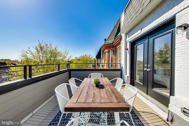a view of a balcony with furniture