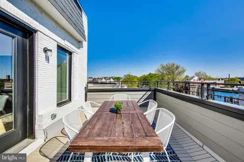 a view of swimming pool from a balcony