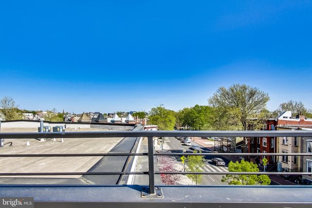 a view of a balcony with city view