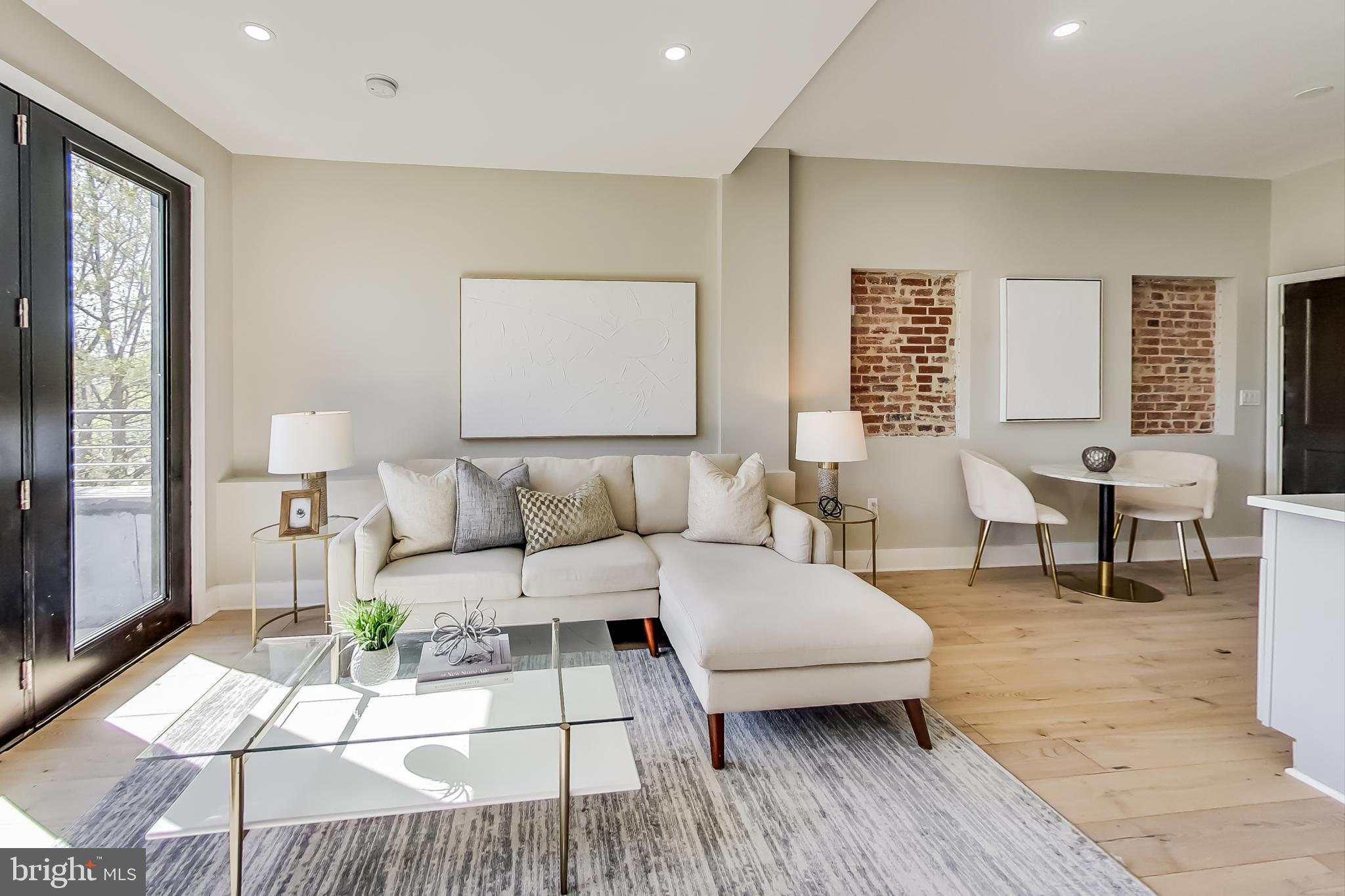 207 Florida Avenue Northwest, Unit 3 Washington, DC 20001 - Photo 4 of 34 a living room with furniture and wooden floor