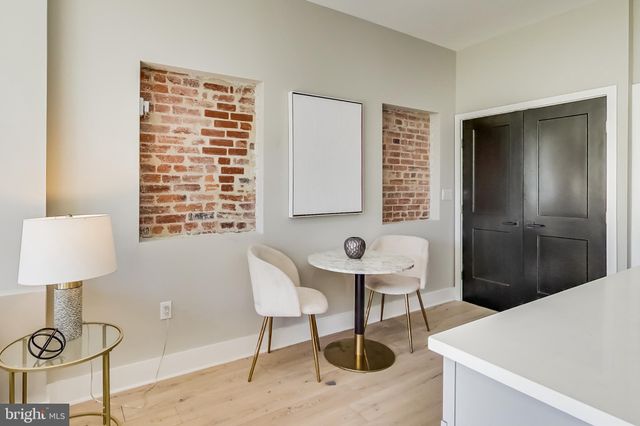a bathroom with a sink and a chair