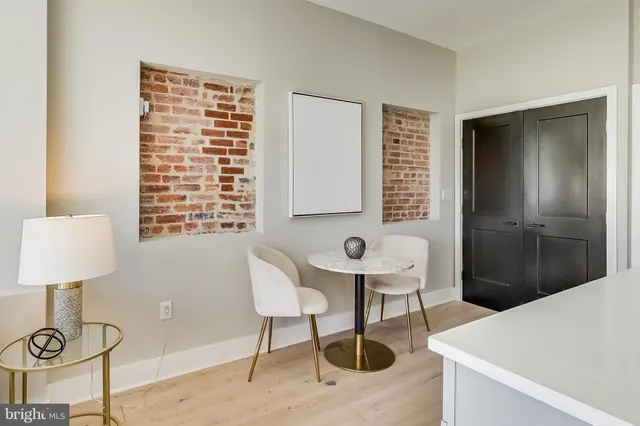 a bathroom with a sink and a chair