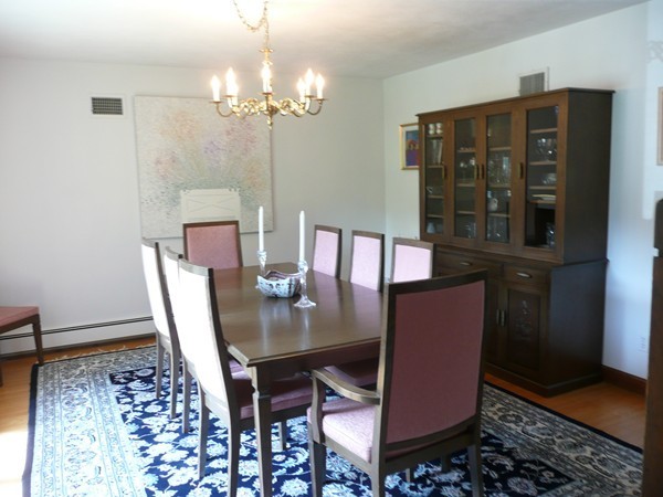 11 Barrett Road Lexington, MA 02421 - Photo 6 of 14 a view of a dining room with furniture and chandelier