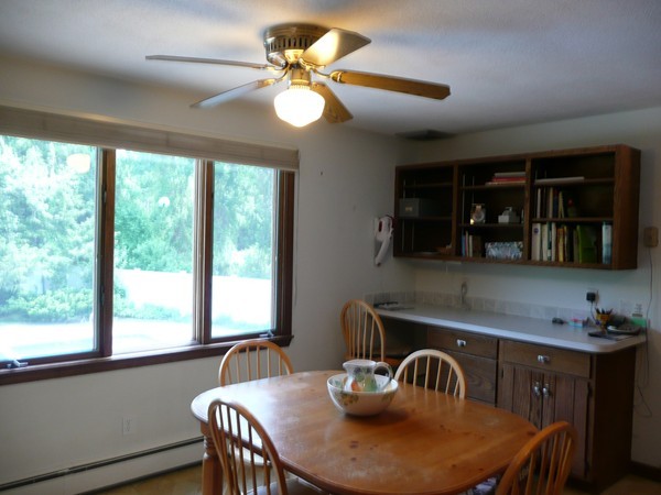 11 Barrett Road Lexington, MA 02421 - Photo 8 of 14 a kitchen with a table chairs and a dining table with wooden floor