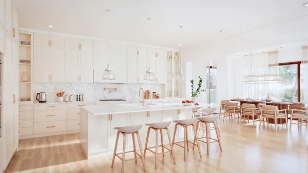a kitchen with stainless steel appliances white cabinets and wooden floors