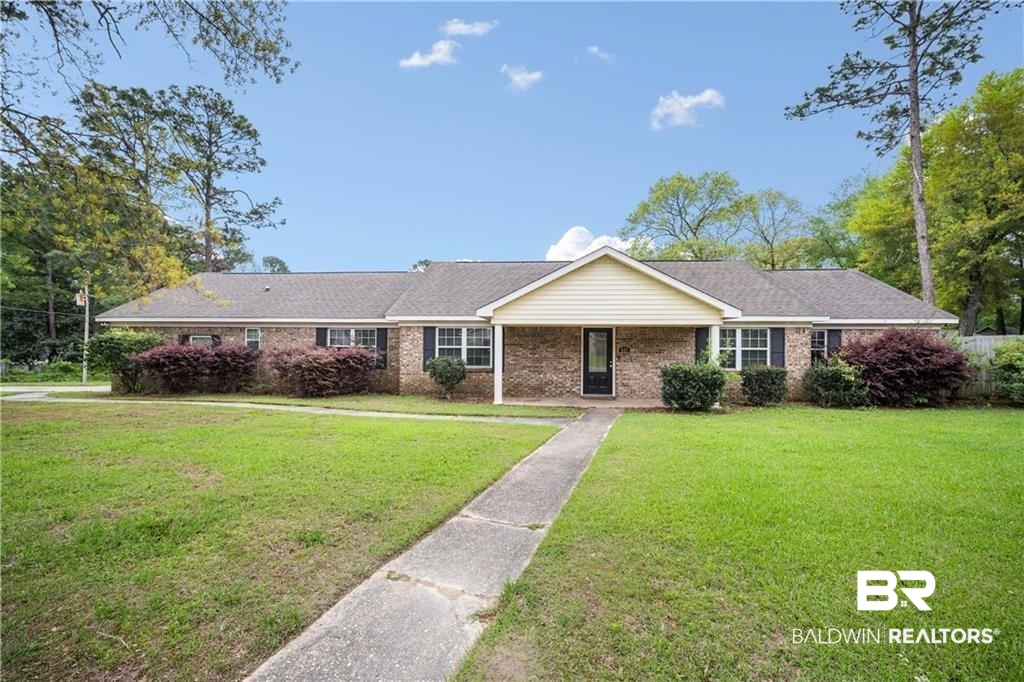 627 Spanish Main Spanish Fort, AL 36527 - Photo 1 of 39 Ranch-style house with brick siding and a front yard