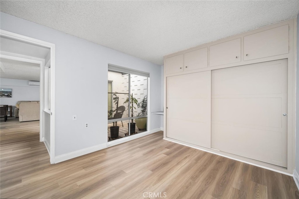 13120 Del Monte Drive, Unit 47G Seal Beach, CA 90740 - Photo 23 of 42 wooden floor in an empty room