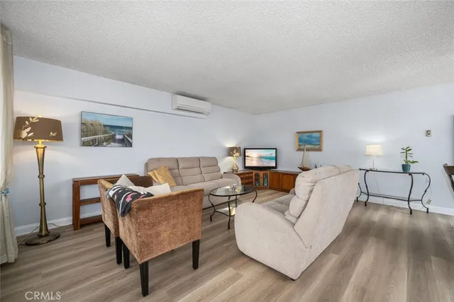 a living room with furniture and a lamp