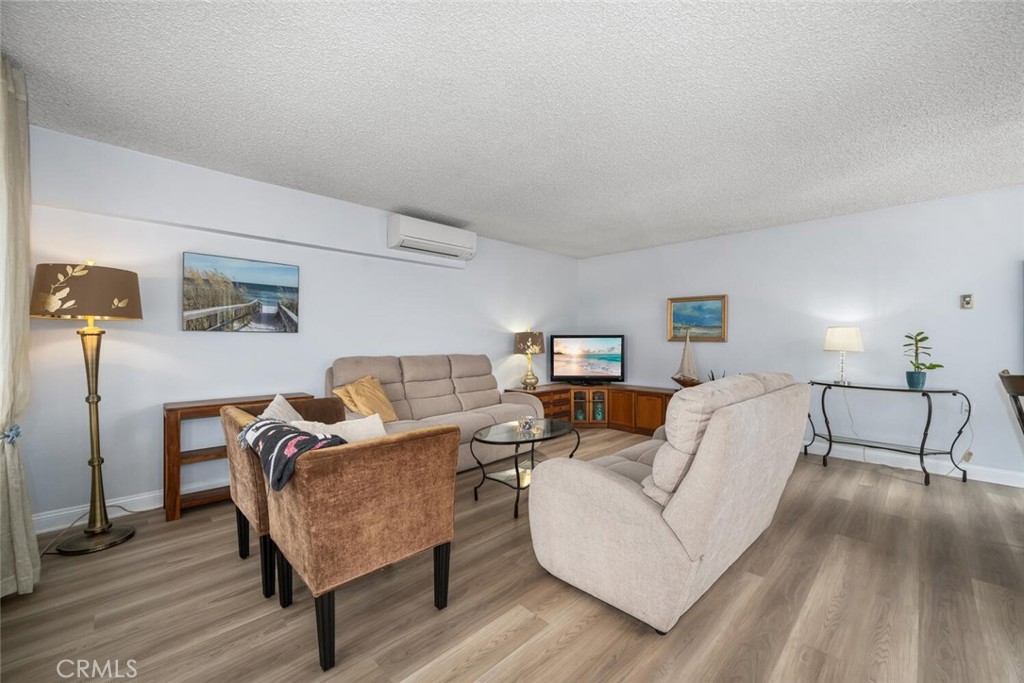 13120 Del Monte Drive, Unit 47G Seal Beach, CA 90740 - Photo 5 of 42 a living room with furniture and a lamp