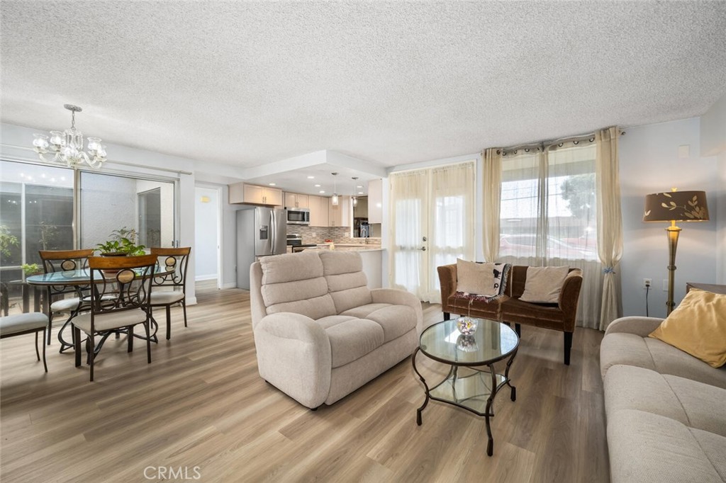 13120 Del Monte Drive, Unit 47G Seal Beach, CA 90740 - Photo 9 of 42 a living room with furniture and a large window