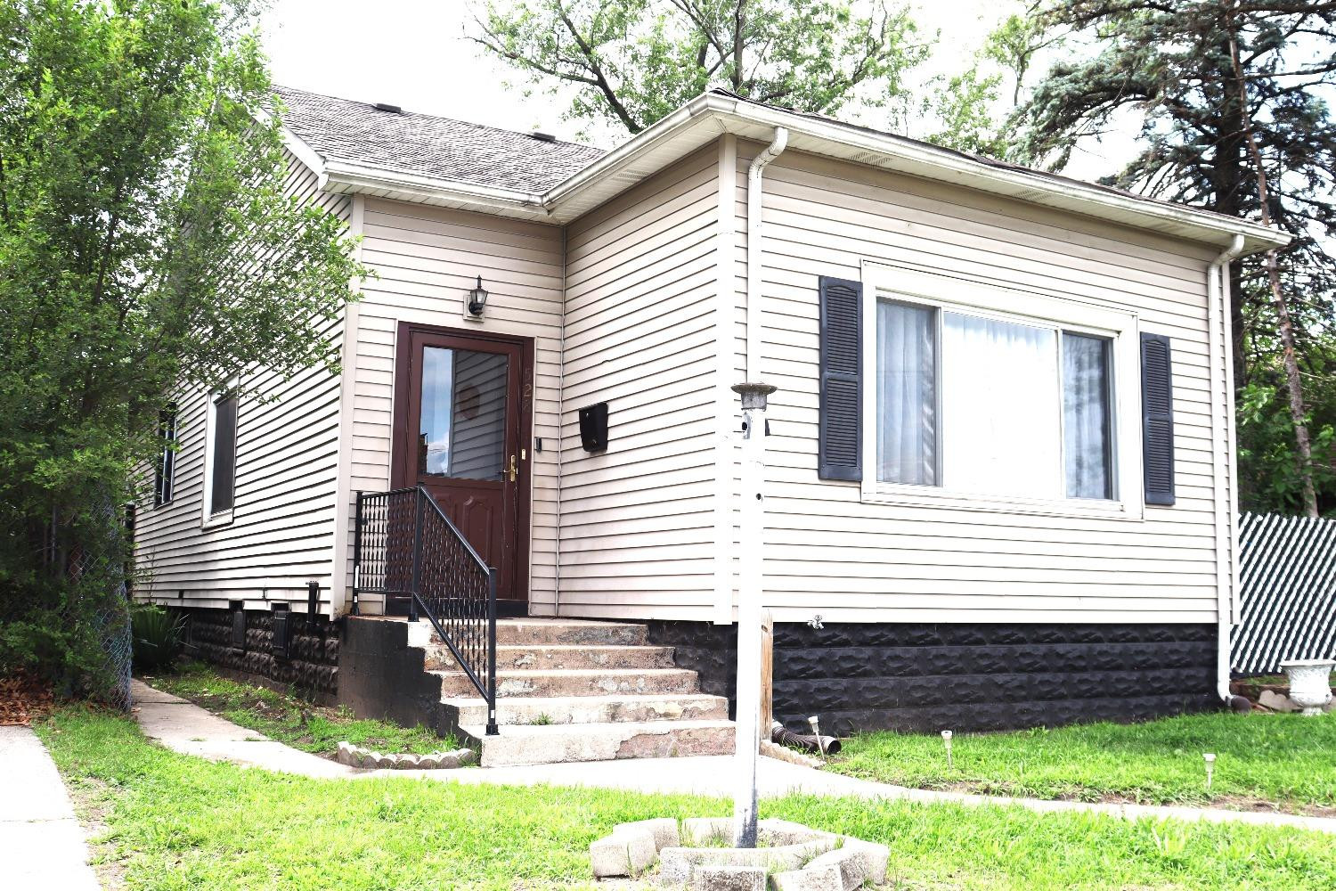 528 Mount Street Gary, IN 46406 - Photo 2 of 29 a front view of a house with a yard
