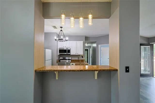 a view of a kitchen from the kitchen