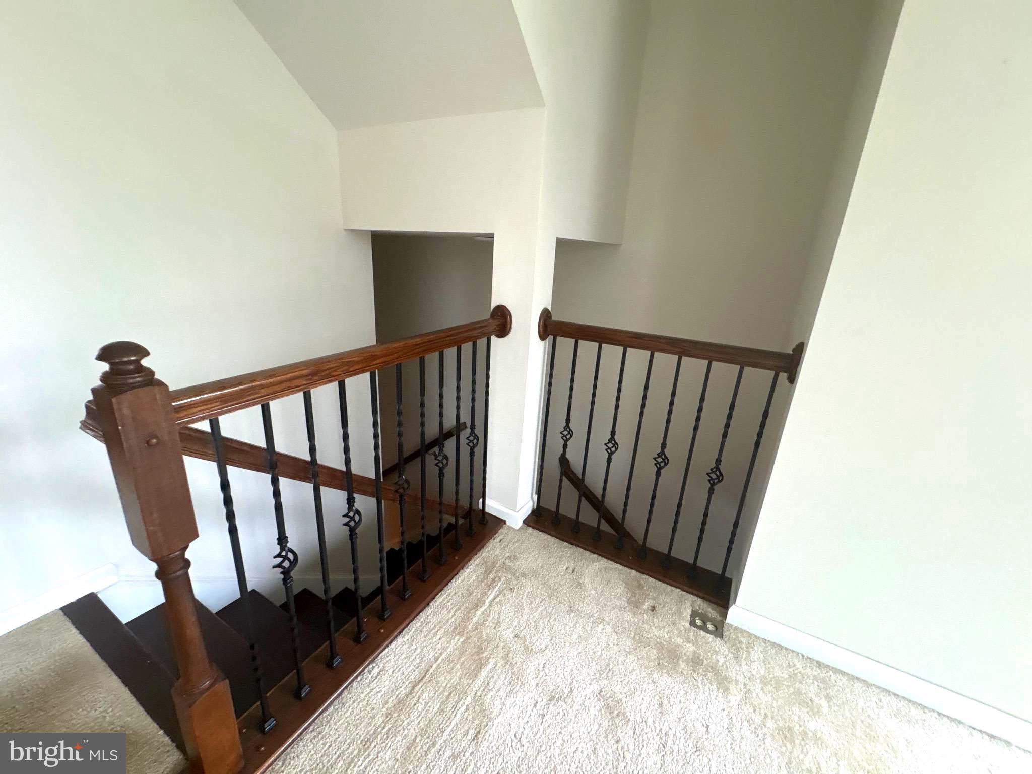 642 Barrie Road Middletown, DE 19709 - Photo 13 of 36 a view of a hallway with wooden floor and staircase
