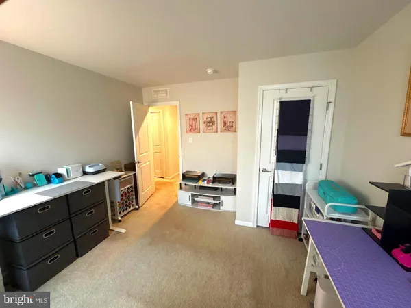 a view of a livingroom with furniture and a window