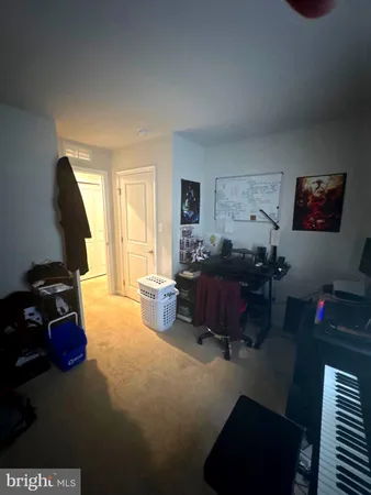 a living room with furniture windows and a flat screen tv