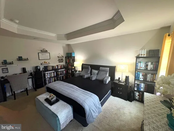 a bed room with furniture and a lamp