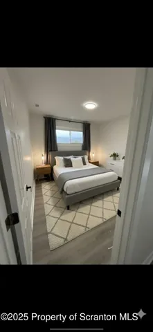 a view of entryway with wooden floor