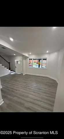 a view of a room with an empty space