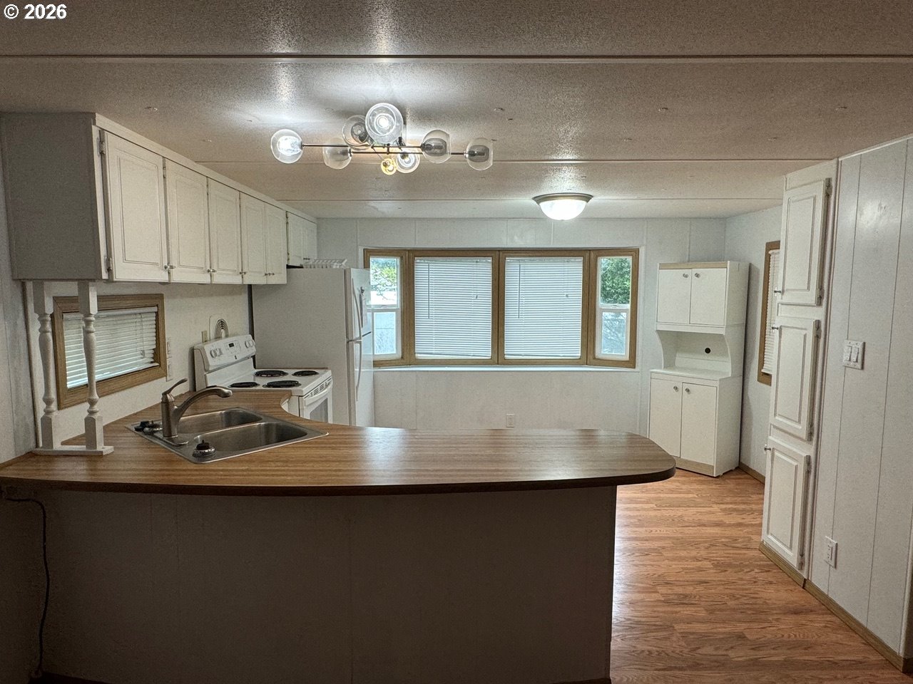 1600 Rhododendron Drive, Unit 293 Florence, OR 97439 - Photo 12 of 26 a view of kitchen and windows