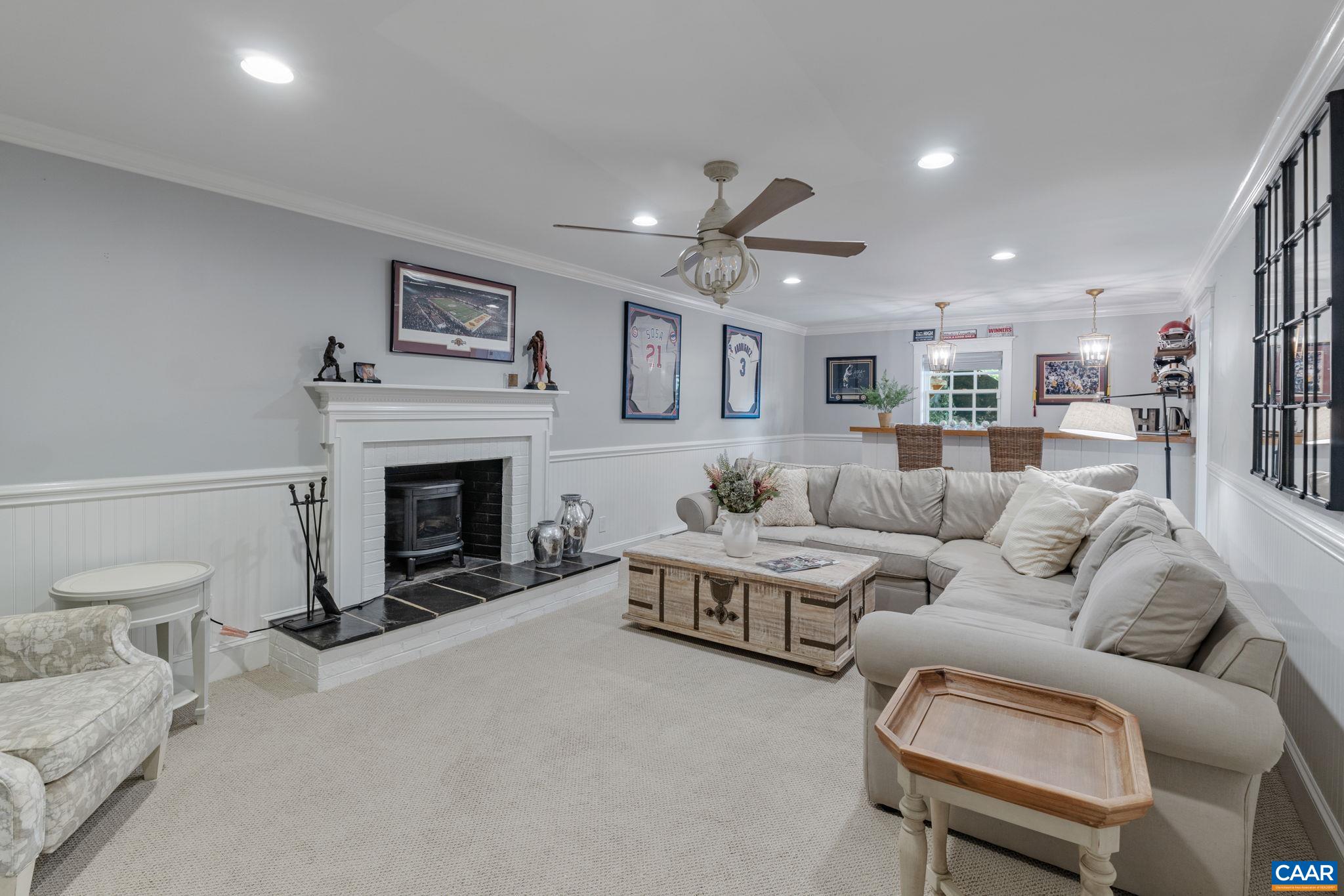 1707 Lambs Road Charlottesville, VA 22901 - Photo 46 of 74 a living room with furniture and a fireplace