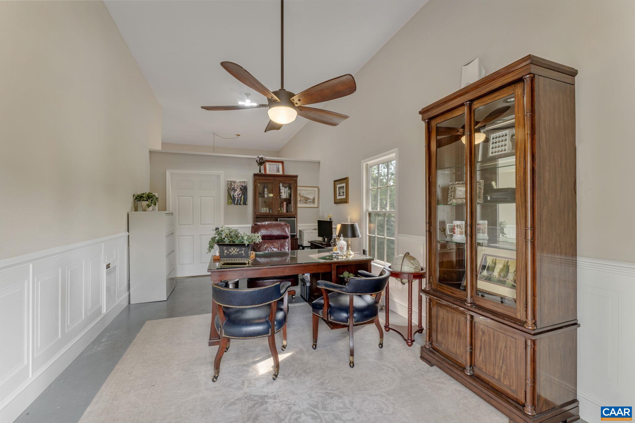 1707 Lambs Road Charlottesville, VA 22901 - Photo 54 of 74 a view of a workspace with furniture and a window