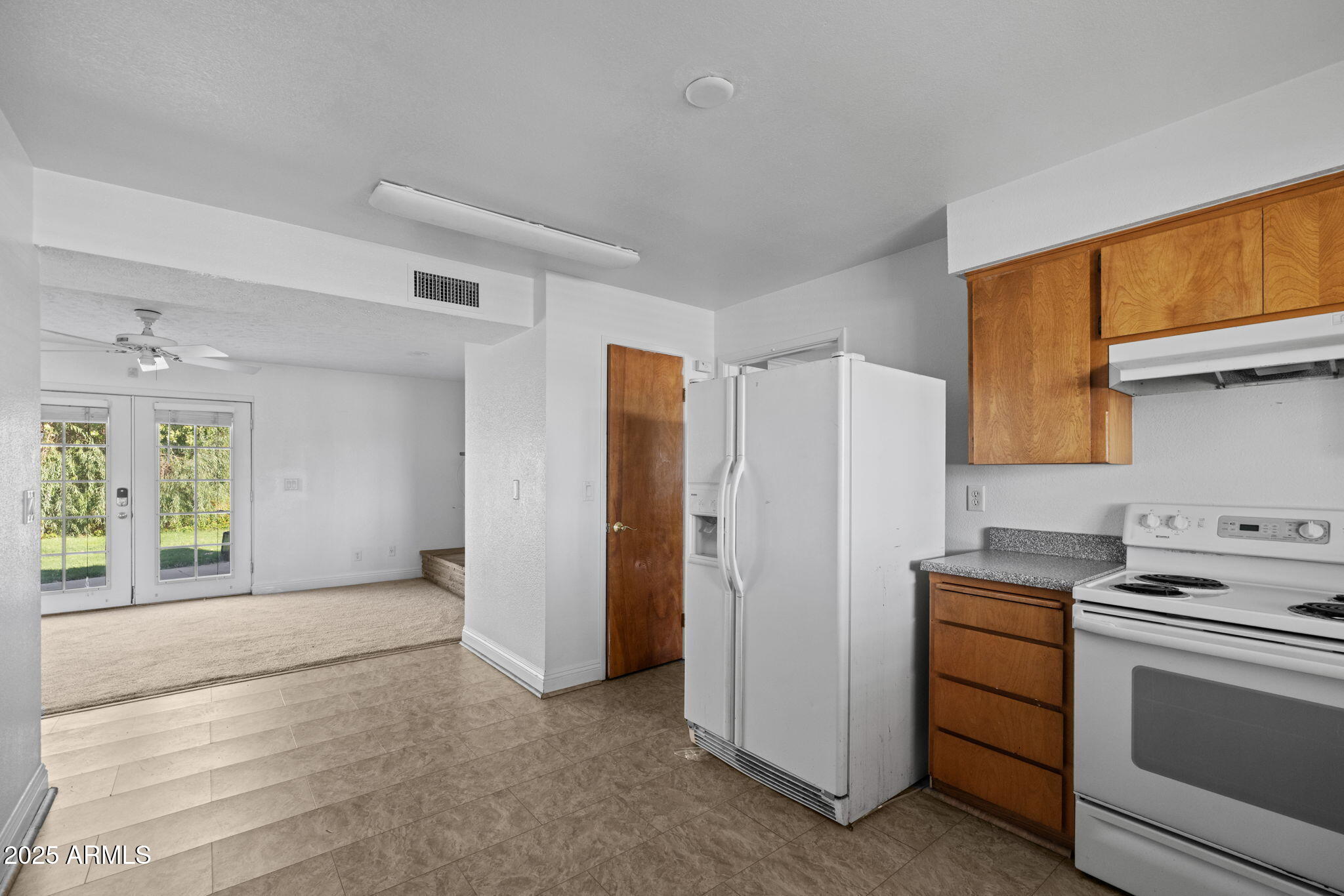 333 South Cooper Road Chandler, AZ 85225 - Photo 3 of 68 a kitchen with white cabinets and white appliances