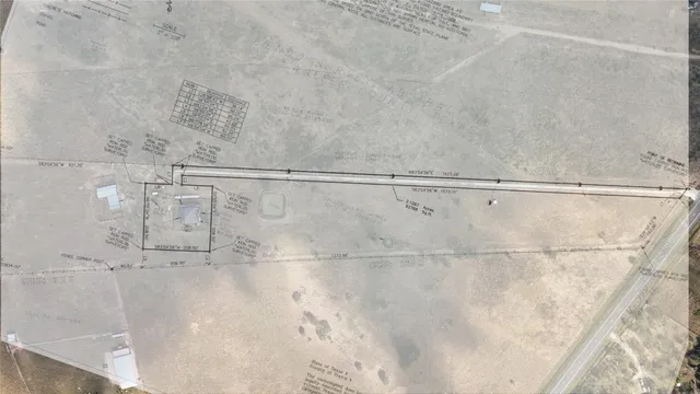 an aerial view of residential house and beach