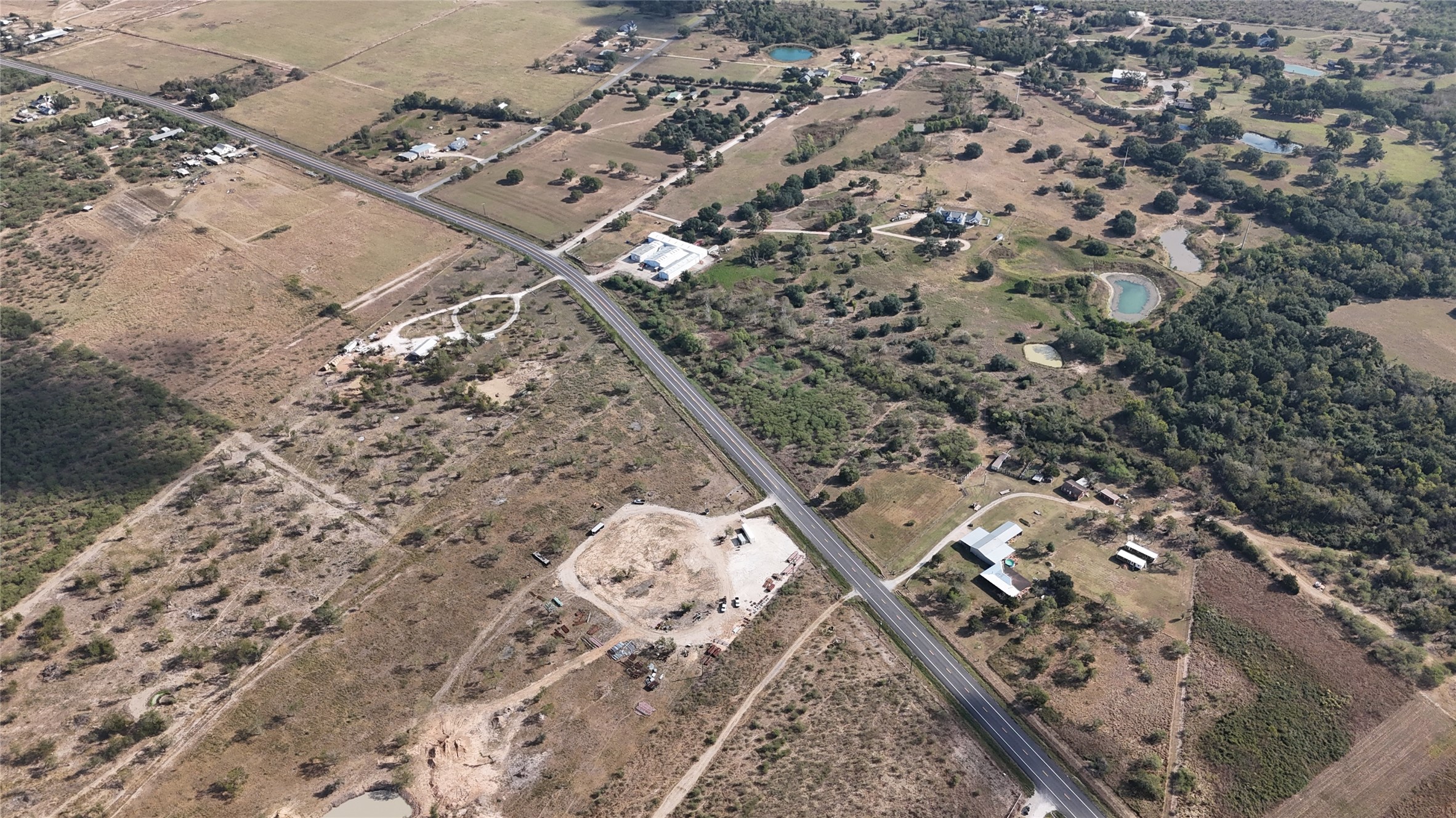 14777 Farm To Market 359 Hempstead, TX 77445 - Photo 18 of 18 an aerial view of a house with a yard
