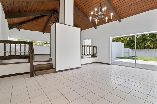 a view of a house with a yard and garage