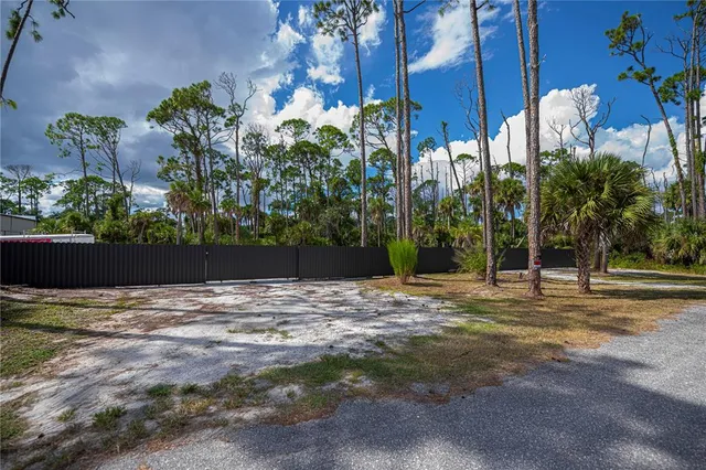 a view of a backyard of the house