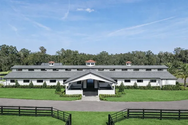 a aerial view of a house with a yard