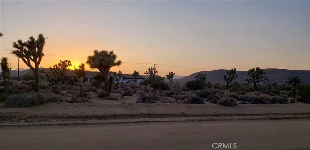 1234 Canton Street Yucca Valley, CA 92284 - Photo 21 of 27 a view of a town with mountains in the background