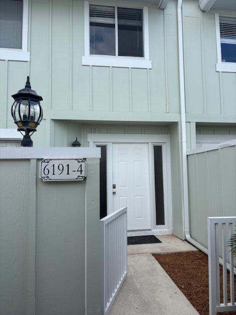 a kitchen with stainless steel appliances granite countertop white cabinets and a stove