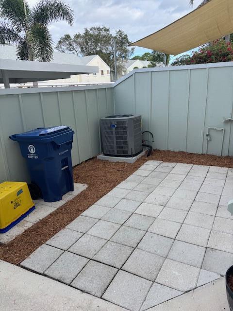 6191 Riverwalk Lane, Unit 4 Jupiter, FL 33458 - Photo 2 of 16 a view of a backyard