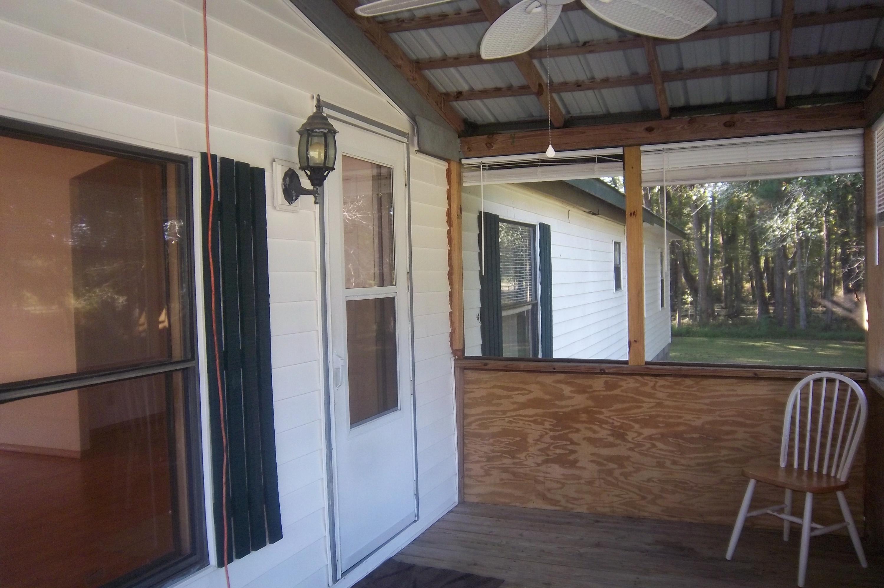 416 Sullivans Ferry Road Cottageville, SC 29435 - Photo 6 of 48 Screened Porch, inside & front door