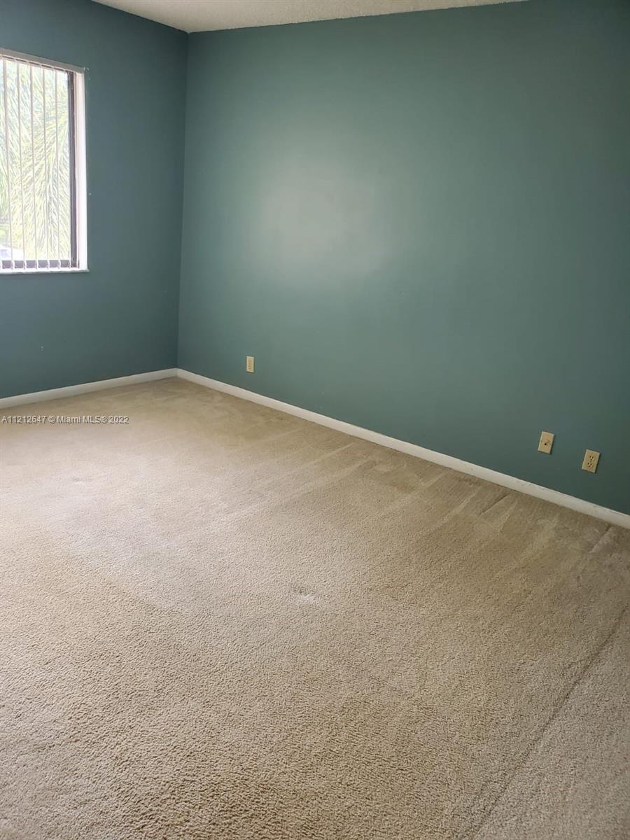 370 Racquet Club Road, Unit 204 Weston, FL 33326 - Photo 11 of 12 an empty room with a window