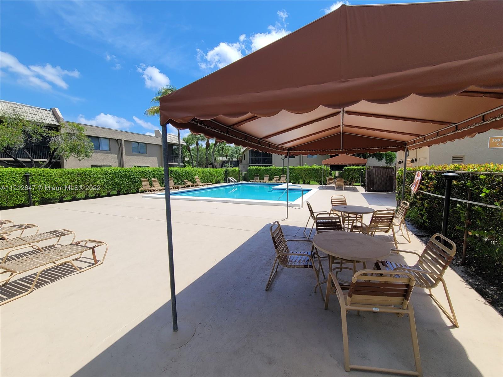 370 Racquet Club Road, Unit 204 Weston, FL 33326 - Photo 4 of 12 a view of a backyard with sitting area