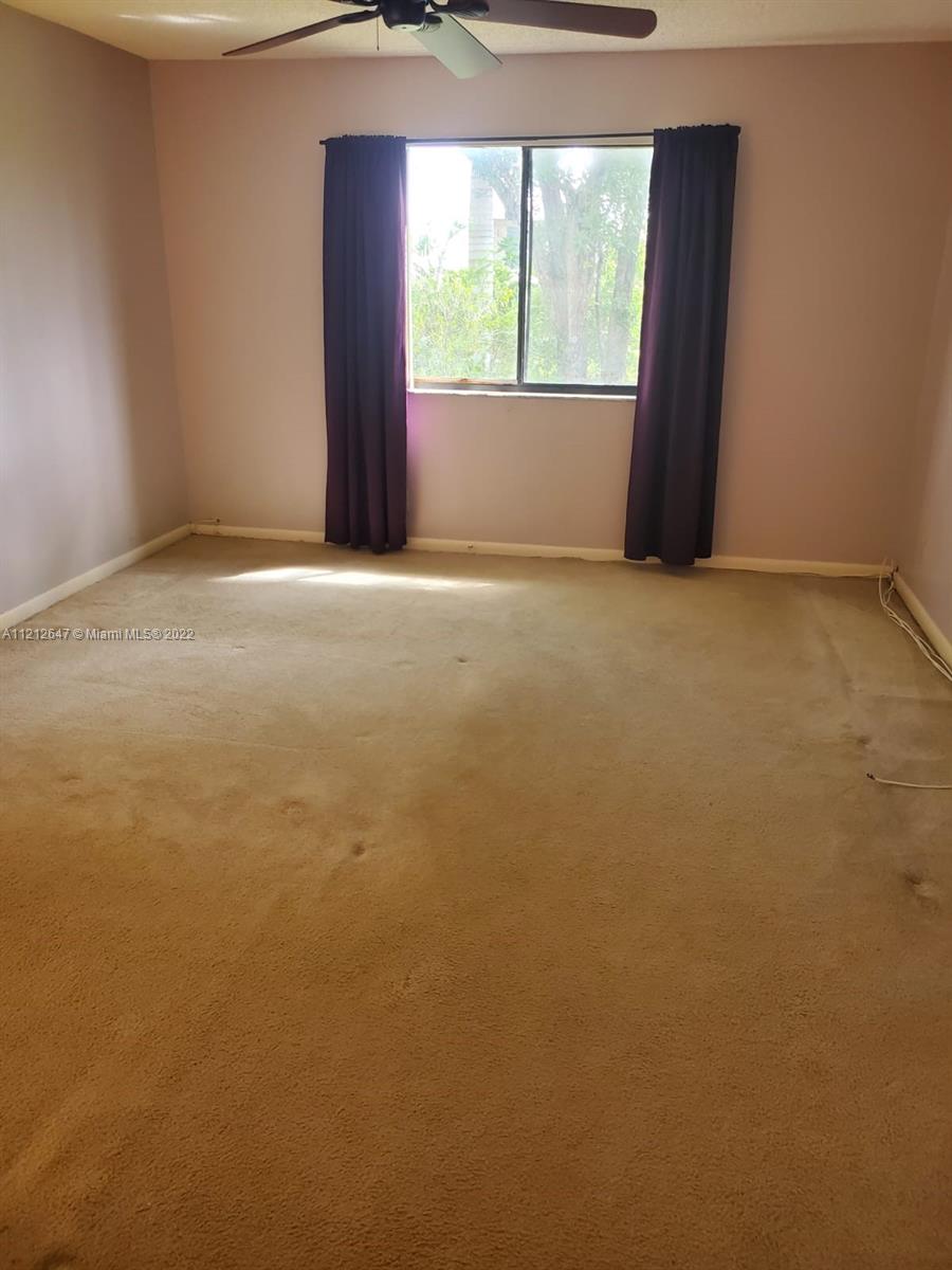 370 Racquet Club Road, Unit 204 Weston, FL 33326 - Photo 8 of 12 a view of an empty room with a window
